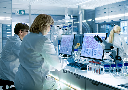 Image portraying scientists in a lab conducting bio research